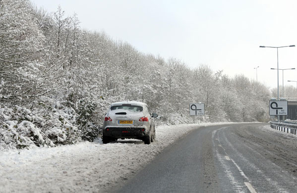 Travel chaos: A vehicles abandoned by the side of a road in Basingstoke
