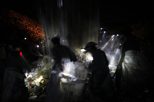 24 hours: Illegal immigrants from Burma work on a rubbish dump in Thailand