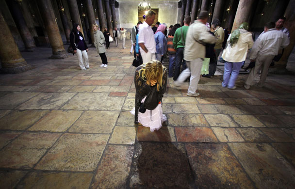 24 hours: Pilgrim prays in central nave of the Church of the Nativity in Bethlehem