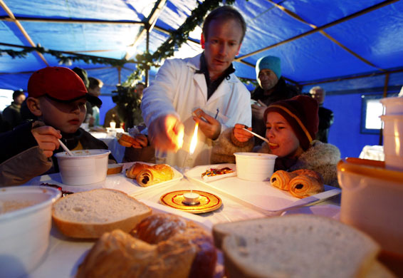 24 hours in pictures: Budapest, Hungary: Homeless boys eat a free Christmas lunch
