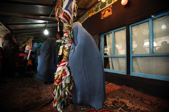 Ashura processions: Afghan Shiite Muslim women pray during Ashura at a Shiite mosque