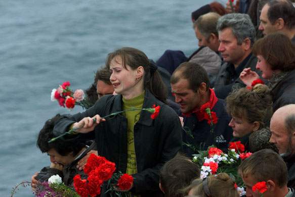 Pictures of the Decade: 24 August 2000: Relatives of the crew of the submarine Kursk throw flowers