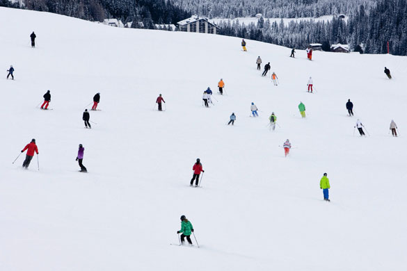 24 hours: Arosa, Switzerland: Crowds of skiers on the runs of the ski resort 