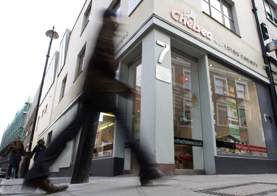 Week in Business: A man walks past a branch of the Chelsea Building Society