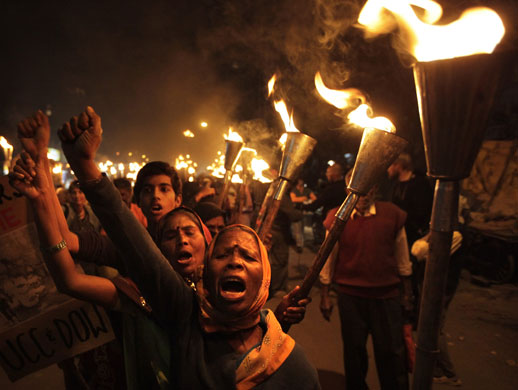 3 December 2009: Bhopal, India: Local activists shout slogans during a torch rally