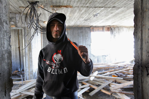 3 December 2009: A Palestinian labourer works in a new housing project