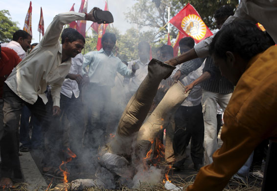 3 December 2009: Mumbai, India: Demonstrators burn an effigy