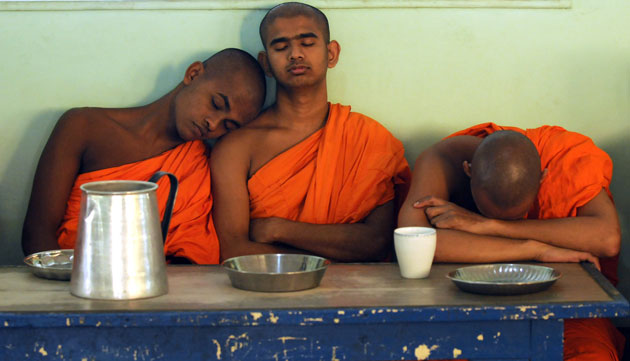 3 December 2009: Colombo, Sri Lanka: Student monks await breakfast