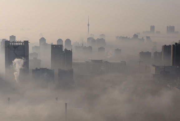 3 December 2009: Wuhan, China: Buildings amid heavy fog