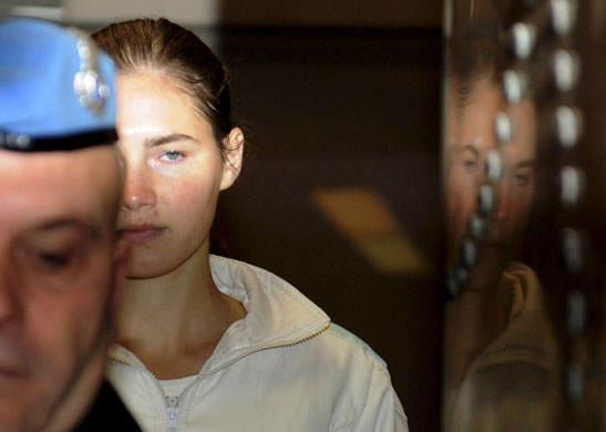 Meredith Kercher trial: 28 November 2009: Amanda Knox is escorted into the courtroom