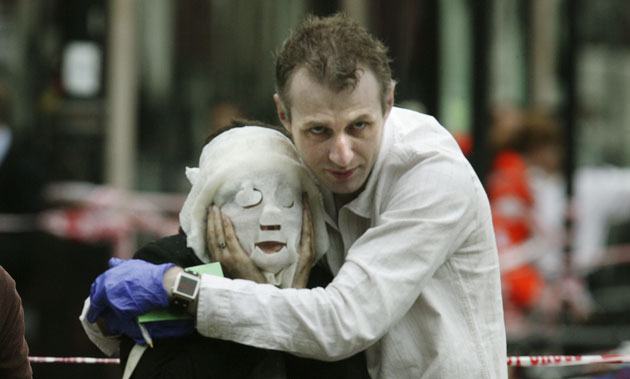Pictures of the Decade: 7 July 2005: An injured passenger is helped away from Edgware Road station