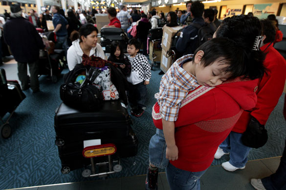 Airport security: British Columbia, Canada: A child sleeps at check in