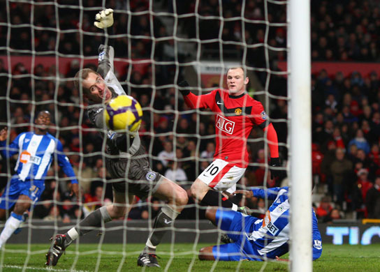 24sport: Wayne Rooney scores the opening goal in their 5-0 victory over Wigan