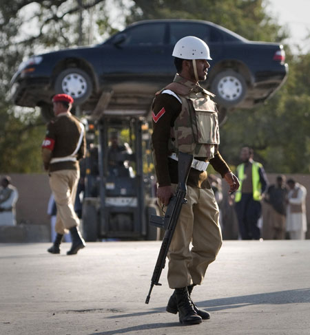 Rawalpindi blasts : A vehicle is removed from the site of a mosque attack in Rawalpindi