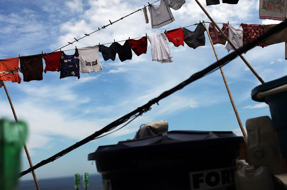 4 December 2009: Rio De Janeiro, Brazil: Laundry hangs on a line in the Babil nia slum
