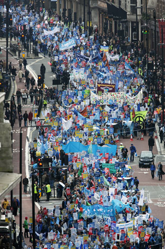 Wave climate change demo: The march makes its way along Piccadilly towards Piccadilly Circus