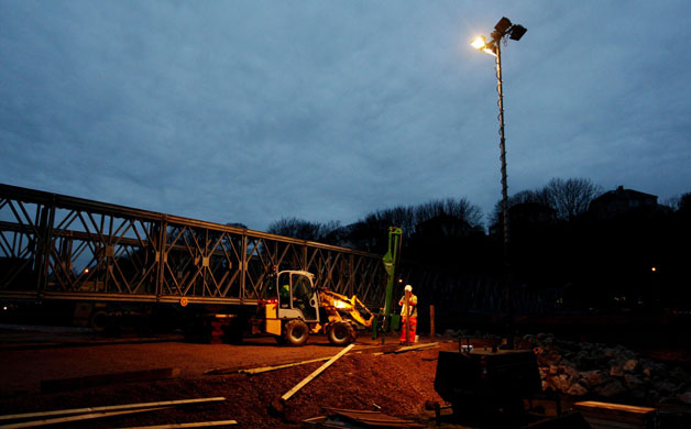 Workington: Contractors work under floodlights