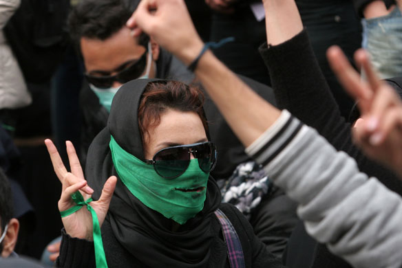 Tehran protests: Iranian opposition supporter gestures at an anti-government demonstration