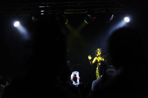 24 hours in pictures: Tijuana, Mexico: A woman dances in a disco 
