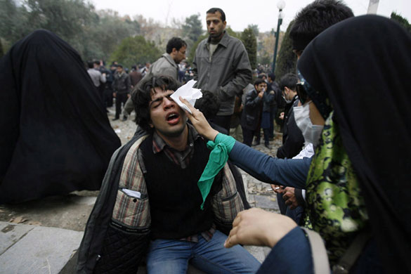 More violence in Tehran: An injured Iranian protester receives help during a demonstrations