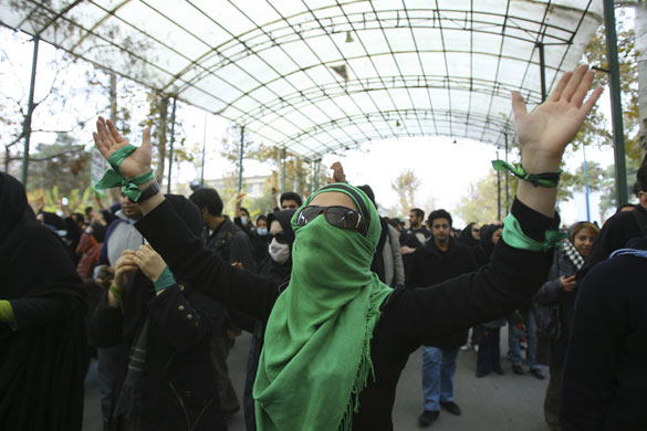 More violence in Tehran: An anti-government Iranian female student wearing a green scarf