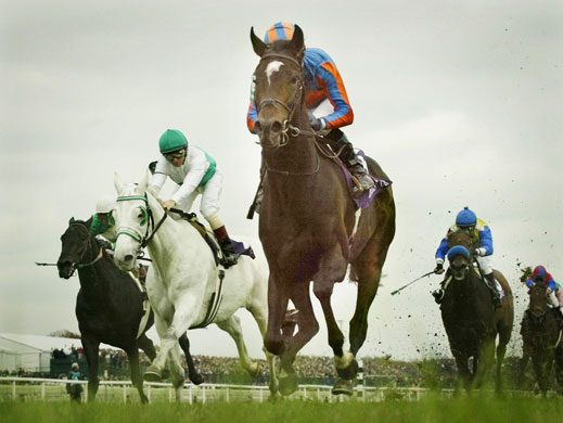 Mick Kinane Life:  Irish-bred High Chaparral, ridden by Michael Kinane, leads the field