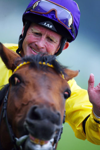 Mick Kinane Life: Mick Kinane celebrates on Sea The Stars after landing the 2009 Derby