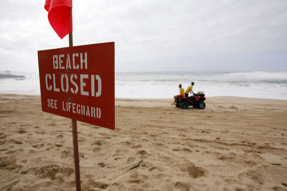 Hawaii waves: Water Safety Officers patrol the beach