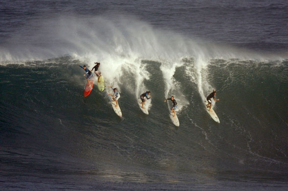 Hawaii waves: Six surfers drop into a wave during pre-contest surfing