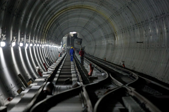 24 hours in pictures: Cairo, Egypt: Workers walk down a metro construction tunnel