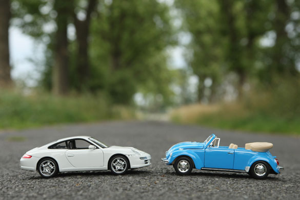 Year in Business: June: A toy Porsche Carrera, left, and a toy Volkswagen Beetle convertible