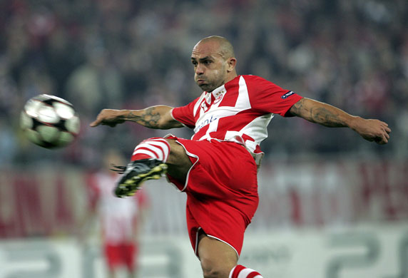 Wednesday CL 2: Olympiacos' Raoul Bravo hoofs a left foot shot  