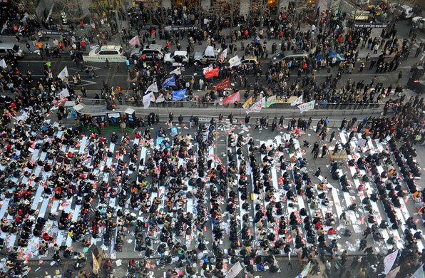 Gallery 24 hours in pictures: Seoul, South Korea: South Korean demonstrators at a candle-lit vigil. 