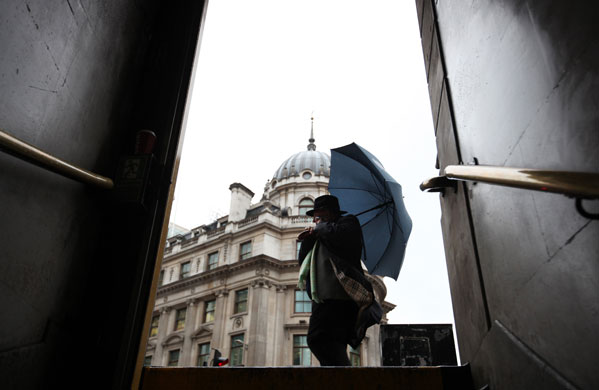 24 hours in pictures : The City of London in heavy rain