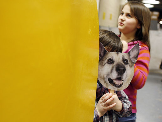 24 hours in pictures : A child   backstage at  Westminster Dog Show 