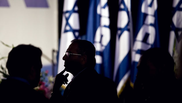 Elections in Israel: A member of the Likud party awaits the speech from Binyamin Netanyahu
