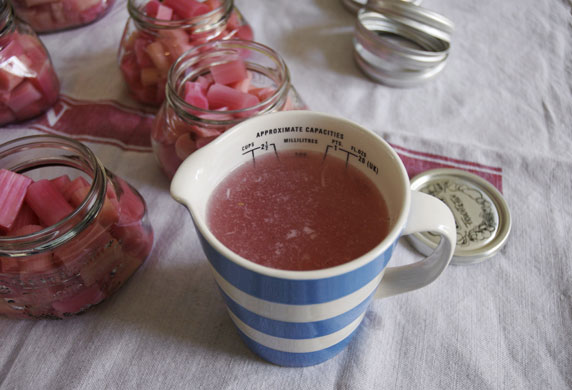 Rhubarb bottling: Put the syrup back into a pan and bring to the boil