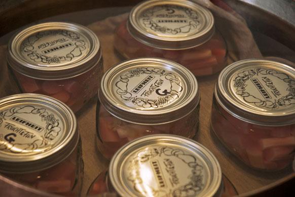 Rhubarb bottling: Over half an hour, bring the water bath up to a gentle simmer