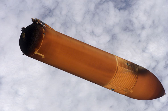 Space debris: External fuel tank of the space shuttle Discovery falls back to earth.