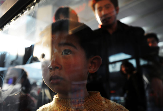 24 hours in pictures: chinese railpassengers return as spring festival holiday ends