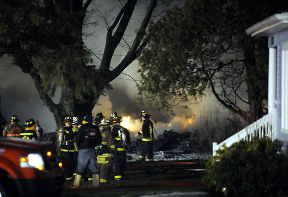 Plane crash in Buffalo: Firefighters at the site of the wreckage of a plane crash in Buffalo