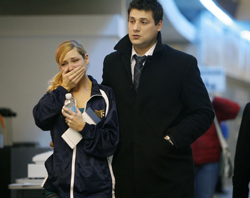 New York plane crash: Family members leave the Buffalo Niagara Airport.