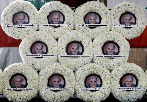 24 hours in pictures: White wreaths containing the portrait of Rafiq Hariri