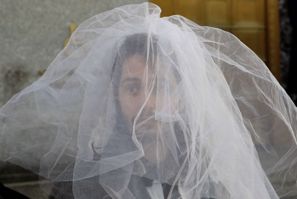 24 hours in pictures: US Gay activist wears a wedding veil  at New York City Wedding Bureau