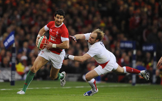 wales v england: Mike Phillips escapes from Andy Goode.