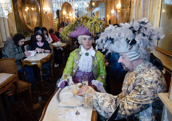 Venice carnival: Costumed revellers have a break in the Caffe Florian.