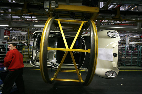 Cowley mini production: A car rotated 90 degrees on BMW's Mini production line in Cowley, Oxford.