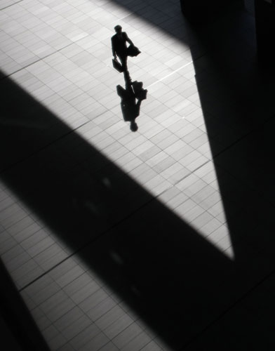 24 hours in pictures: A pedestrian is in the business district in Tokyo