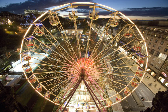 Big wheels : A ferris wheel beneath Edinburgh Castle.