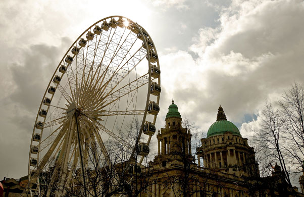 Big wheels : Belfast's Ferris Wheel towers over City Hall in Donegall Square. 